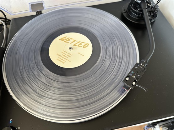 Transparent record on a record deck with Wet Leg on the label